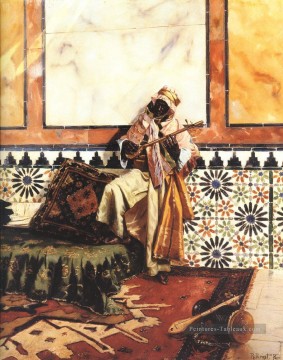 Gnaoua dans un intérieur nord africain Rudolf Ernst Peinture à l'huile